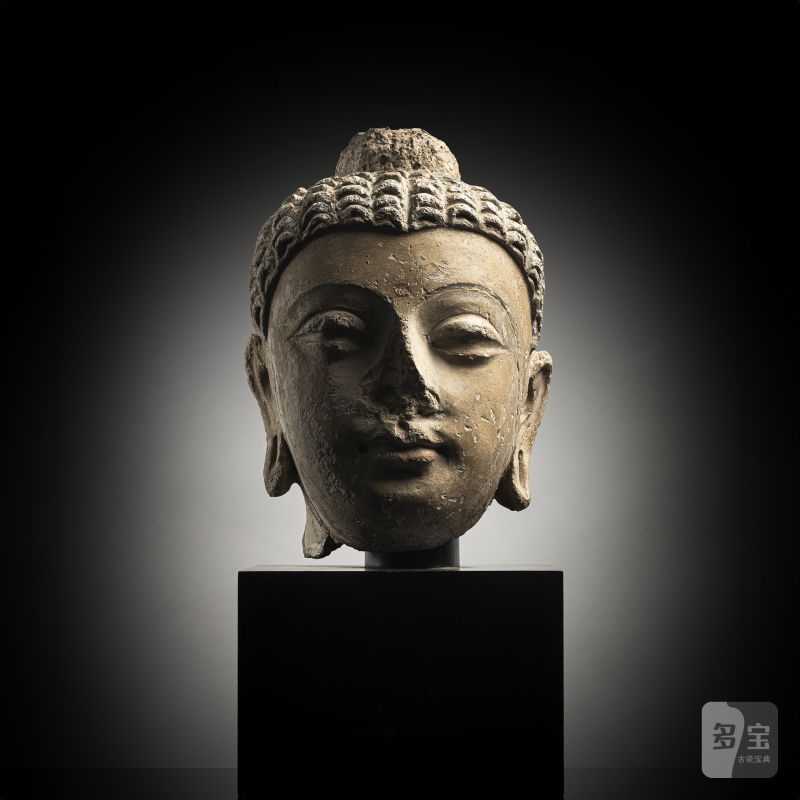 A STUCCO HEAD OF BUDDHA SHAKYAMUNI